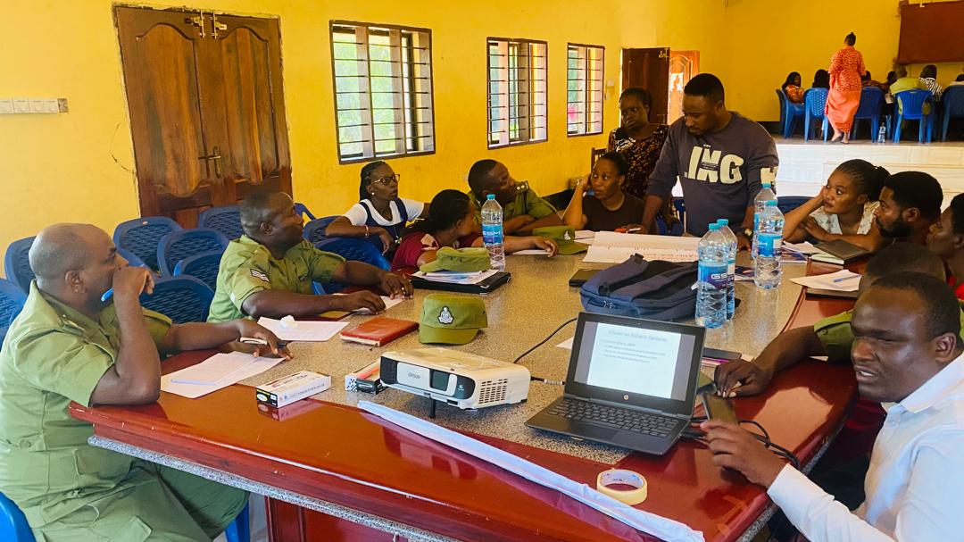 Community members meet around a table for a discussion.